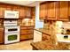 Modern kitchen featuring granite countertops and beautiful wood cabinets at 4230 Arborwood Ln, Tampa, FL 33618