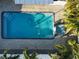 Inviting refreshing blue pool with surrounding patio at 4292 Maple Ne St, St Petersburg, FL 33703