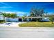 Updated home with a large grassy yard and a long driveway at 4292 Maple Ne St, St Petersburg, FL 33703