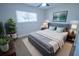 Cozy bedroom with a queen-size bed and stylish decor at 4292 Maple Ne St, St Petersburg, FL 33703