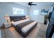 Spacious bedroom with a king-size bed and updated light fixtures at 4292 Maple Ne St, St Petersburg, FL 33703