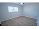 Well-lit bedroom with light walls and new flooring at 4292 Maple Ne St, St Petersburg, FL 33703