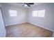Simple bedroom with two windows and new flooring at 4292 Maple Ne St, St Petersburg, FL 33703