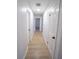 Clean hallway with light walls and new flooring at 4292 Maple Ne St, St Petersburg, FL 33703