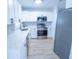 Modern kitchen with stainless steel appliances and white cabinets at 4292 Maple Ne St, St Petersburg, FL 33703