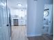 Open concept kitchen with stainless steel appliances and adjacent bathroom at 4292 Maple Ne St, St Petersburg, FL 33703