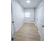 Bright laundry room with washer, dryer, and ample storage at 4292 Maple Ne St, St Petersburg, FL 33703