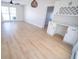 Open living space with light wood flooring and built-in bar at 4292 Maple Ne St, St Petersburg, FL 33703