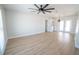 Spacious living area with light wood flooring and ceiling fan at 4292 Maple Ne St, St Petersburg, FL 33703