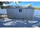 Exterior view of a gray storage shed at 4292 Maple Ne St, St Petersburg, FL 33703