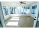 Sunroom with tile floors and large windows at 4292 Maple Ne St, St Petersburg, FL 33703
