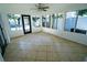 Spacious sunroom with tile floor and pool view at 4292 Maple Ne St, St Petersburg, FL 33703