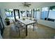 Sunroom with table and chairs, overlooking the pool at 4292 Maple Ne St, St Petersburg, FL 33703