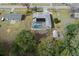 Aerial view of house, pool, and surrounding landscape at 4438 Crescent Rd, Spring Hill, FL 34606