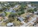 Aerial view showing home, pool, and neighborhood at 4438 Crescent Rd, Spring Hill, FL 34606