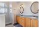 Double vanity bathroom with light wood cabinets and granite counters at 4438 Crescent Rd, Spring Hill, FL 34606