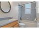 Bathroom with a vanity, toilet, and shower/tub combo at 4438 Crescent Rd, Spring Hill, FL 34606