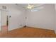 Large bedroom with wood-look floors and ceiling fan at 4438 Crescent Rd, Spring Hill, FL 34606