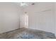 Bedroom with carpet flooring, ceiling fan and double door closet at 4438 Crescent Rd, Spring Hill, FL 34606