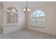 Dining room with large window and chandelier at 4438 Crescent Rd, Spring Hill, FL 34606