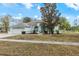 Single-story home with attached garage and landscaping at 4438 Crescent Rd, Spring Hill, FL 34606