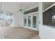 Covered lanai with ceiling fans and access to the pool at 4438 Crescent Rd, Spring Hill, FL 34606