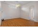 Spacious living room with light walls and wood-look floors at 4438 Crescent Rd, Spring Hill, FL 34606
