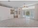Bright living room with tiled floors and access to a pool at 4438 Crescent Rd, Spring Hill, FL 34606
