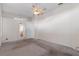Main bedroom with carpet, ceiling fan and en-suite bathroom access at 4438 Crescent Rd, Spring Hill, FL 34606