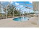 Refreshing pool with screened enclosure and tranquil view at 4438 Crescent Rd, Spring Hill, FL 34606