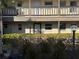 Condo building exterior with balconies and landscaping at 4555 Marine Pkwy # 103, New Port Richey, FL 34652