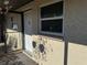 Condo building exterior with entrance and landscaping at 4555 Marine Pkwy # 103, New Port Richey, FL 34652