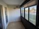 Bright sunroom with canal view and window coverings at 4555 Marine Pkwy # 103, New Port Richey, FL 34652