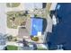 Aerial view showing a single story home with a pool and waterfront access at 4949 Waterside Dr, Port Richey, FL 34668