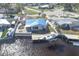 Aerial view of waterfront home with pool and private boat dock at 4949 Waterside Dr, Port Richey, FL 34668