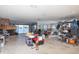Living room with stone fireplace and sliding glass doors to patio at 4949 Waterside Dr, Port Richey, FL 34668