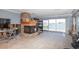 Living room with a stone fireplace and water views at 4949 Waterside Dr, Port Richey, FL 34668