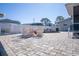 Brick paved patio with seating area near the pool at 4949 Waterside Dr, Port Richey, FL 34668