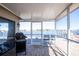 Screened porch overlooking the water with a grill at 4949 Waterside Dr, Port Richey, FL 34668