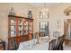 Formal dining room with a large table and hutch at 541 Bent Oak Ct, Spring Hill, FL 34609