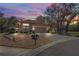 House exterior at dusk, showcasing a two-car garage and landscaping at 541 Bent Oak Ct, Spring Hill, FL 34609