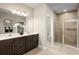 Double vanity bathroom with a large shower and plenty of counter space at 6021 Wild Petunia Dr, Wimauma, FL 33598