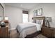 Bright bedroom with a comfortable bed and nightstands at 6021 Wild Petunia Dr, Wimauma, FL 33598