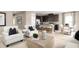 Open living room and kitchen with an island and a dining area at 6021 Wild Petunia Dr, Wimauma, FL 33598