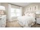Bright bedroom with large window, plush bed, and ample floor space at 6027 Wild Petunia Dr, Wimauma, FL 33598