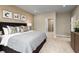 Large main bedroom with king bed and en-suite bathroom at 6027 Wild Petunia Dr, Wimauma, FL 33598