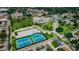 Aerial view of a community featuring tennis courts, pool, and park at 6225 Emerson Dr, New Port Richey, FL 34653