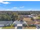 Aerial view of a charming house with a carport, nestled in a quiet neighborhood at 6225 Emerson Dr, New Port Richey, FL 34653