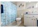 Clean bathroom with shower/tub combo, and light wood vanity at 6225 Emerson Dr, New Port Richey, FL 34653