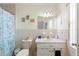 Bathroom with shower/tub combo, vanity, and beachy decor at 6225 Emerson Dr, New Port Richey, FL 34653